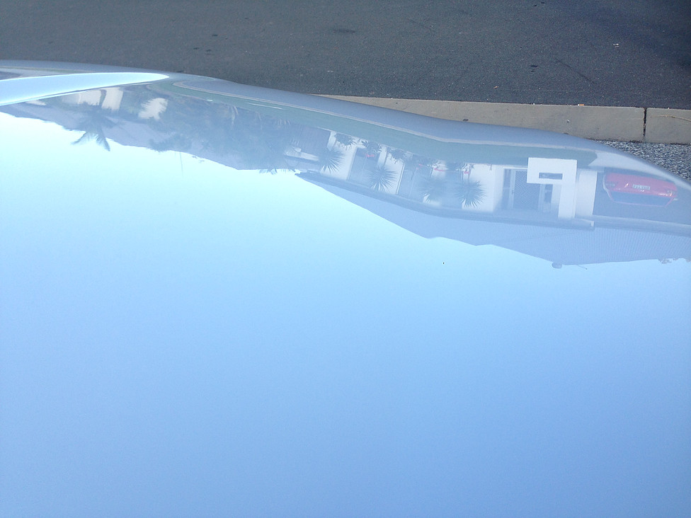 Reflection in the paint of house across the road